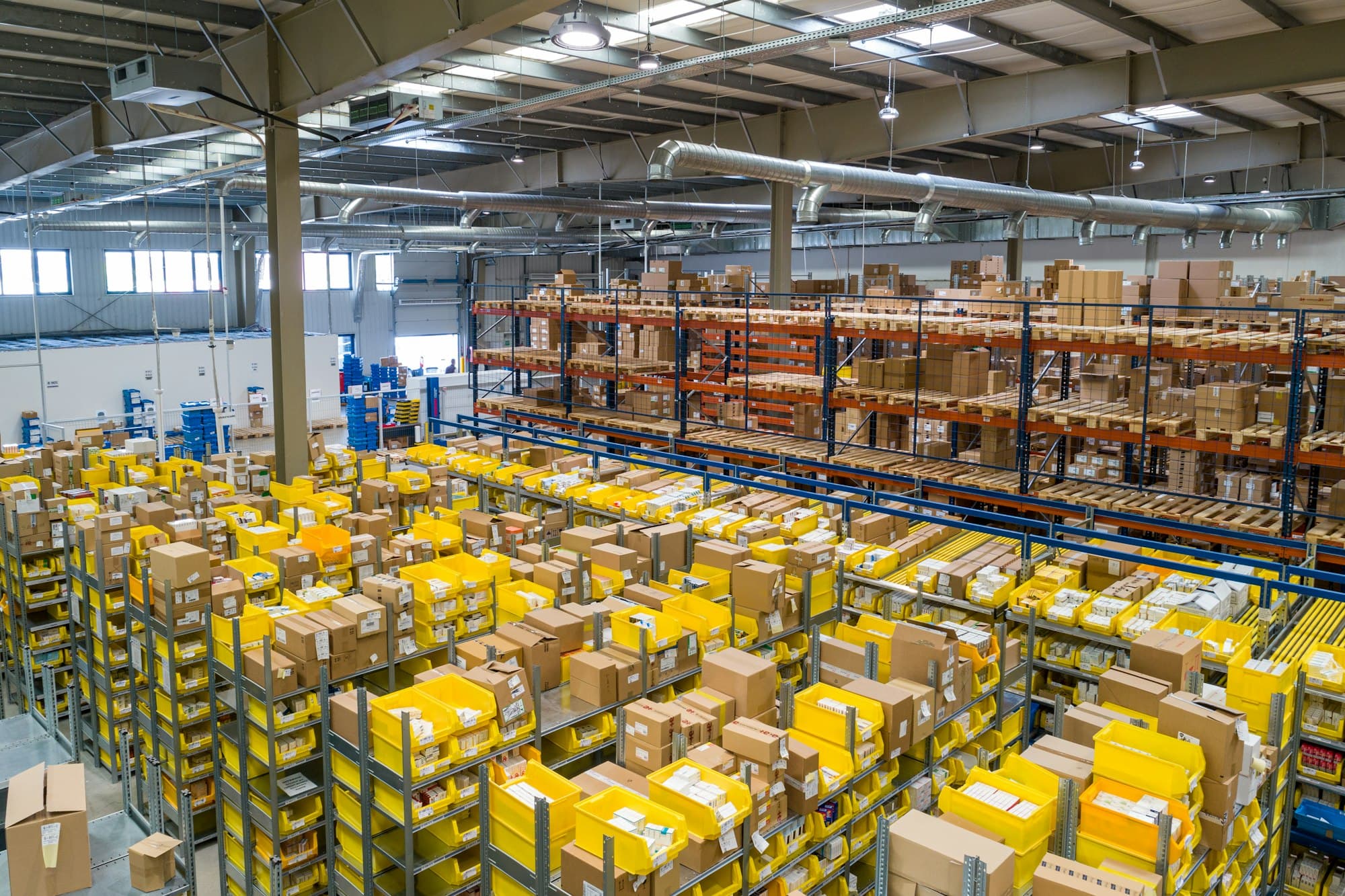 Large warehouse filled with yellow storage crates
